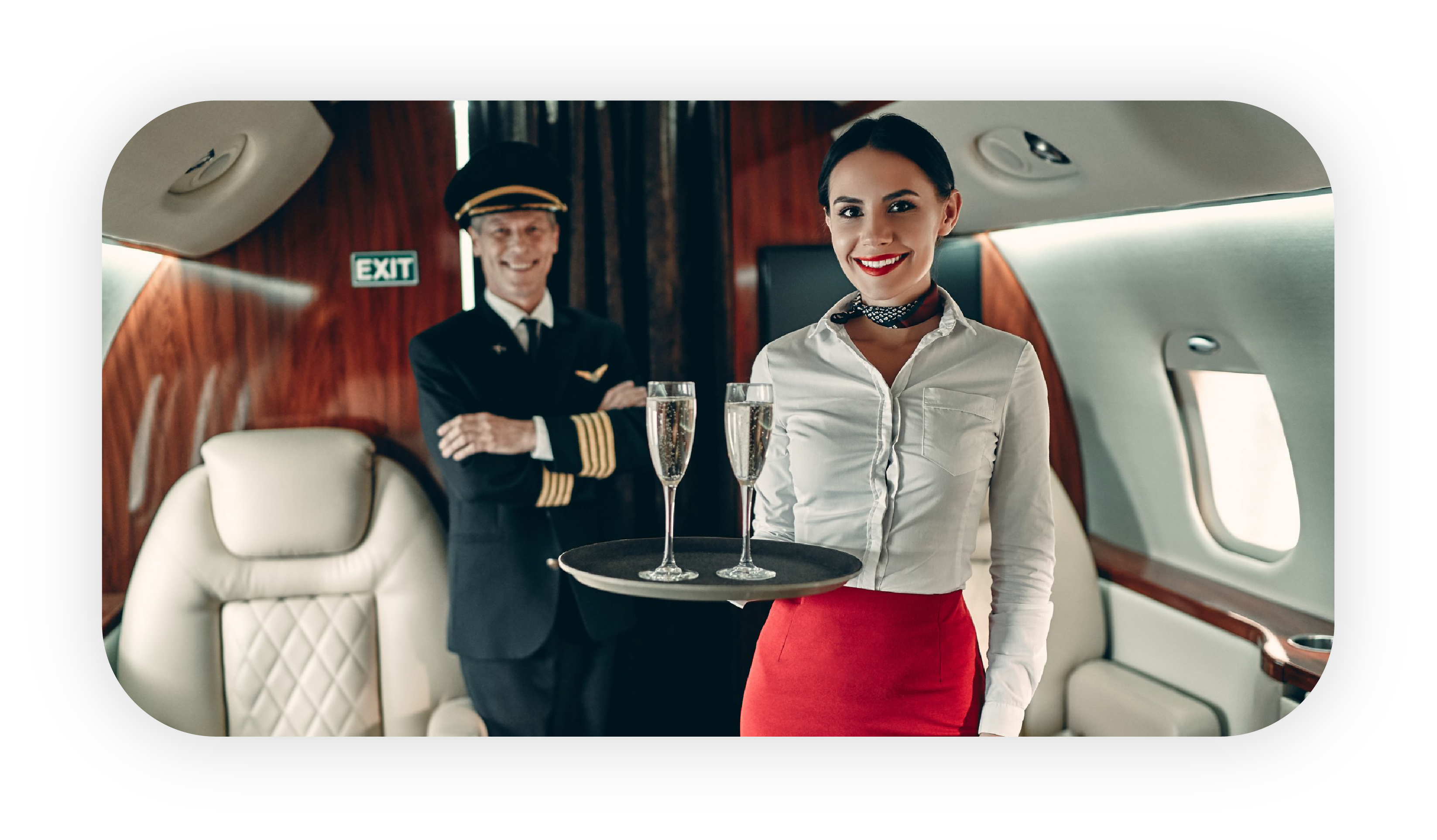 Flight steward serving champagne aboard a private jet